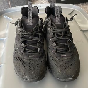Black Nike “react” shoes.